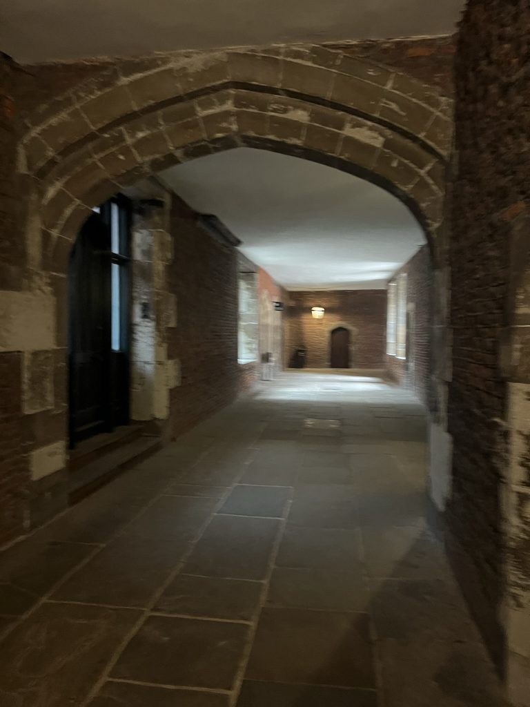 Hallway leading out of the kitchen to the wine cellars and other storage areas.