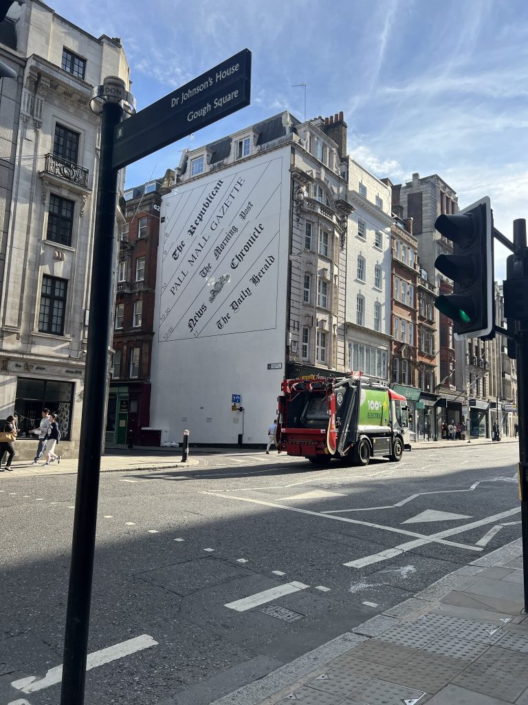 Street view on Fleet Street commemorating the newspapers that were published there. Side of the building lists: The Republican, the Pall Mall Express, The Morning Post, News Chronicle and the Daily Herald.