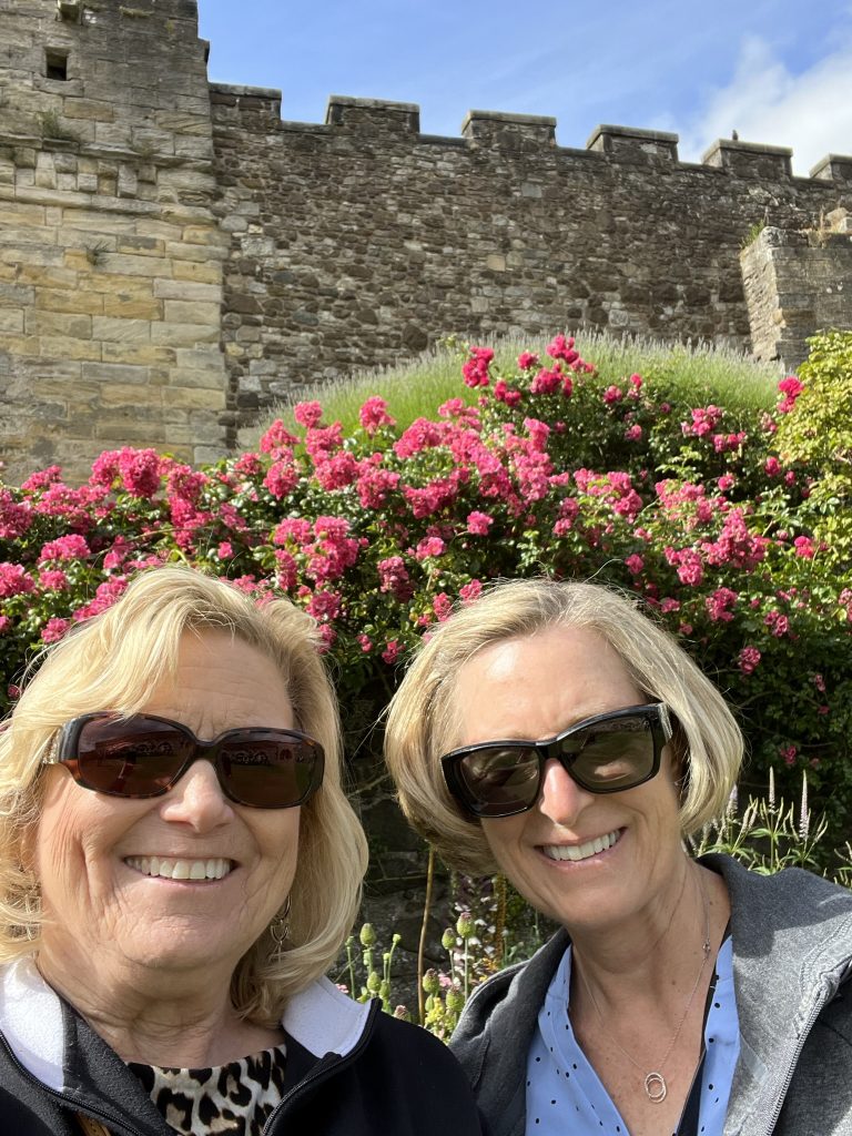 Kay and Melody in the garden with red rose bush behind us. 