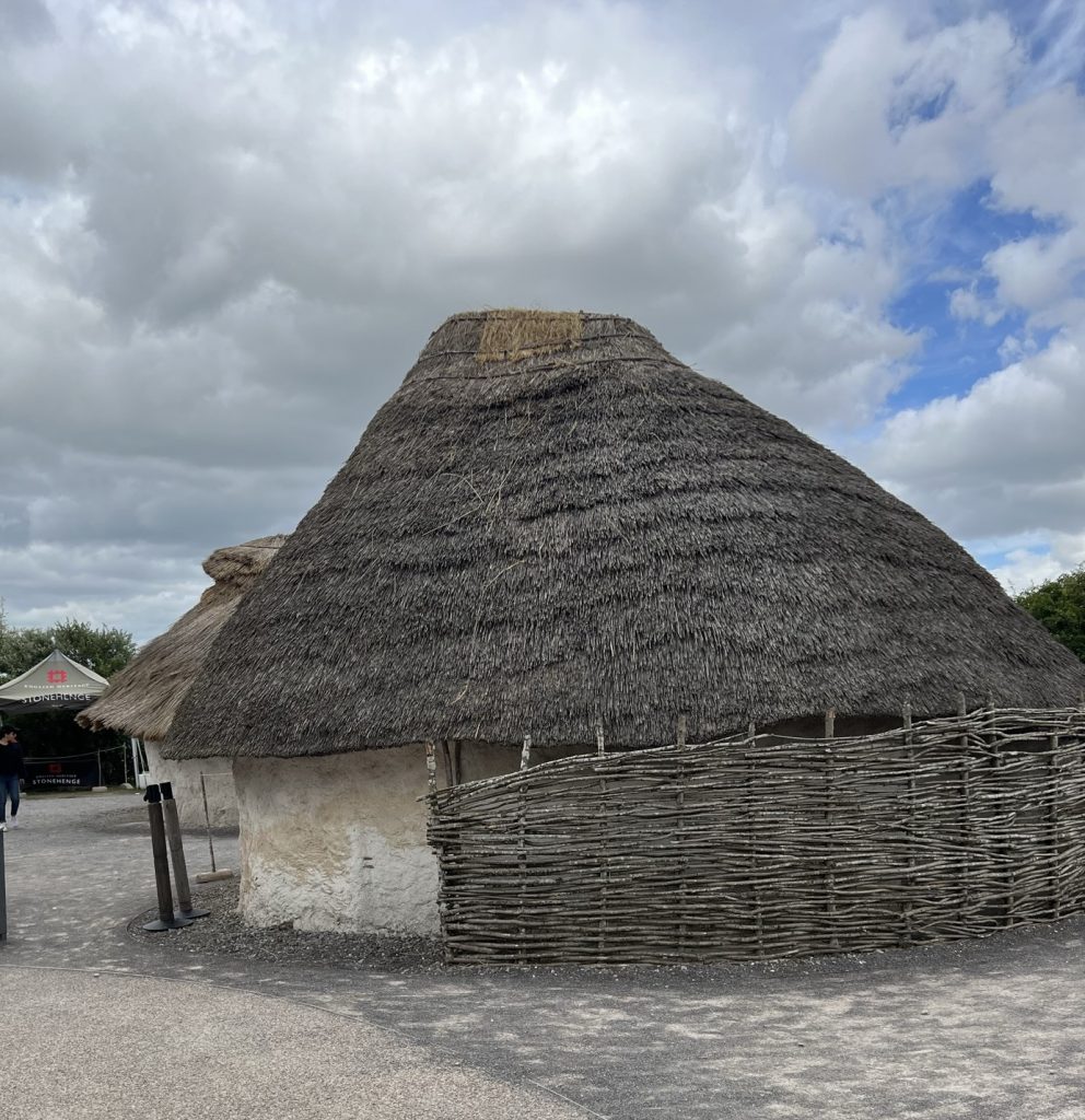 Close up of the hut showing the detail of the thatched roof and the sides made of the sticks and the chalk mixture to make the walls.